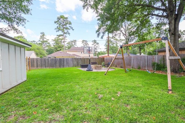 view of yard featuring a patio area and a fire pit