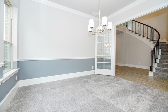 12510 Grayton Dr, Texas City, TX 77568 - carpeted empty room featuring ornamental molding, stairs, a chandelier, and baseboards