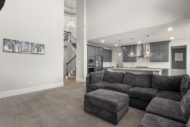 12510 Grayton Dr, Texas City, TX 77568 - living area featuring light colored carpet, recessed lighting, stairway, baseboards, and a towering ceiling