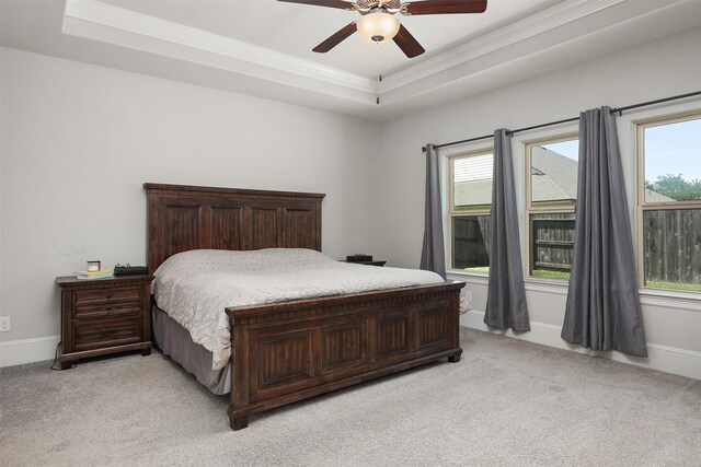 12510 Grayton Dr, Texas City, TX 77568 - bedroom with light colored carpet, a tray ceiling, ornamental molding, and multiple windows