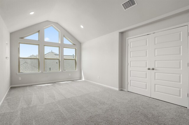 12510 Grayton Dr, Texas City, TX 77568 - unfurnished bedroom featuring vaulted ceiling, carpet flooring, baseboards, a closet, and recessed lighting