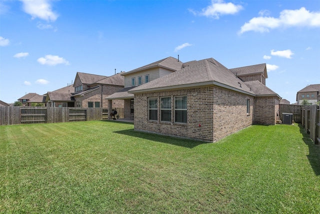 12510 Grayton Dr, Texas City, TX 77568 - rear view of house with brick siding, roof with shingles, and cooling unit