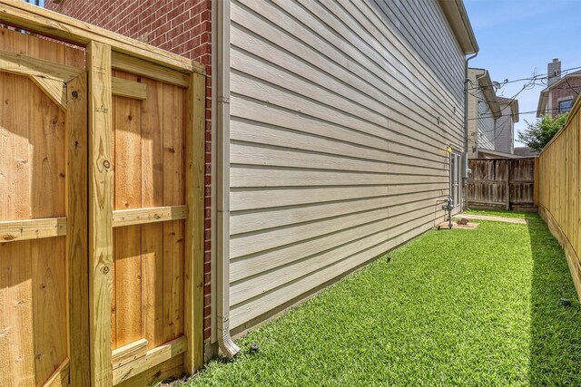 view of side of home featuring brick siding