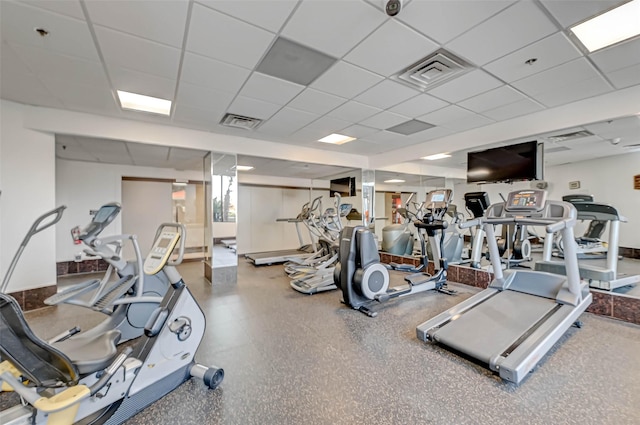exercise room featuring a drop ceiling