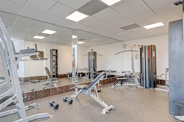 workout area with a paneled ceiling