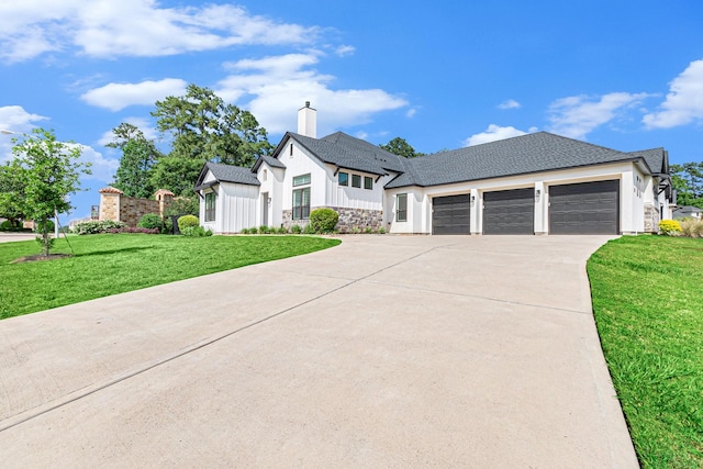 1703 Madera Oaks Ct, Conroe, TX 77304 - view of front of property with an attached garage, driveway, a front lawn, a chimney, and roof with shingles