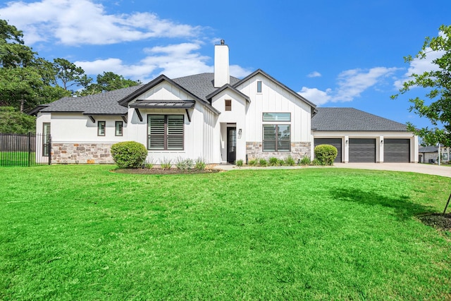 1703 Madera Oaks Ct, Conroe, TX 77304 - modern inspired farmhouse featuring stone siding, board and batten siding, a chimney, and concrete driveway