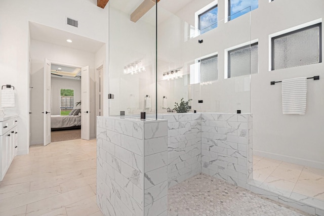 1703 Madera Oaks Ct, Conroe, TX 77304 - full bathroom featuring connected bathroom, marble finish floors, walk in shower, vanity, and a high ceiling