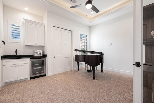 1703 Madera Oaks Ct, Conroe, TX 77304 - living area featuring wine cooler, wet bar, light colored carpet, a ceiling fan, and recessed lighting