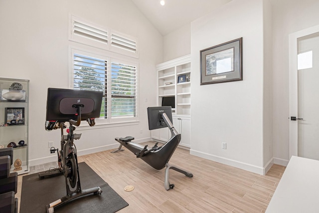 1703 Madera Oaks Ct, Conroe, TX 77304 - workout area featuring light wood finished floors and high vaulted ceiling