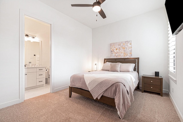 1703 Madera Oaks Ct, Conroe, TX 77304 - bedroom featuring light colored carpet, ensuite bath, and a ceiling fan