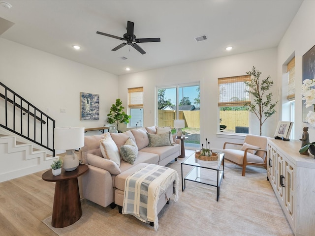 930 Mansfield St, Houston, TX 77091 - living area featuring light wood finished floors, a ceiling fan, stairway, and recessed lighting