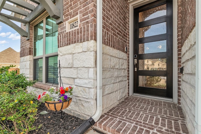 11822 Radura Rd, Humble, TX 77346 - doorway to property with brick siding