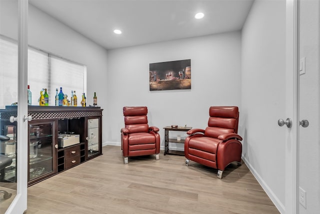 11822 Radura Rd, Humble, TX 77346 - living area featuring light wood-type flooring, recessed lighting, and baseboards