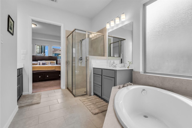 11822 Radura Rd, Humble, TX 77346 - full bath with ensuite bath, a shower stall, vanity, and a bath
