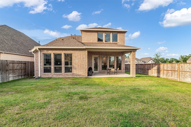 11822 Radura Rd, Humble, TX 77346 - back of property with brick siding, a patio, and a shingled roof