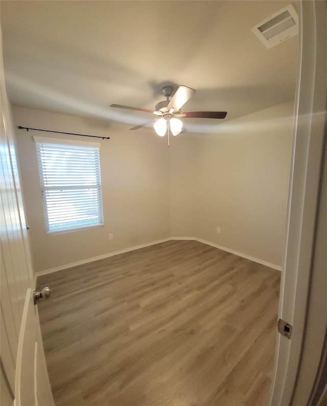 419 8th Ave N, Texas City, TX 77590 - spare room featuring ceiling fan, wood finished floors, and baseboards