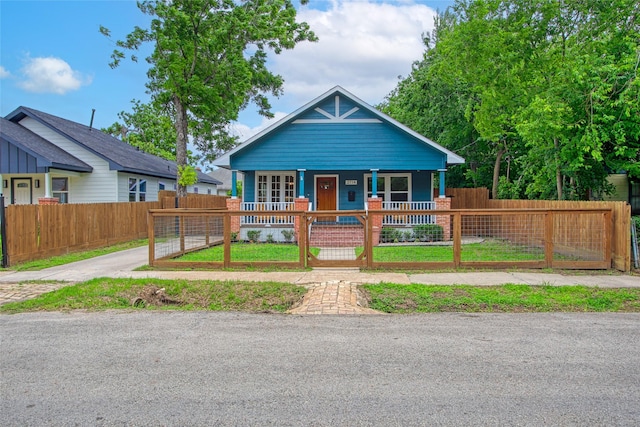 2714 Gano St, Houston, TX 77009 - bungalow-style home featuring covered porch, a fenced front yard, and a gate