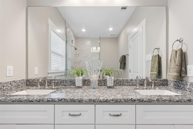 2714 Gano St, Houston, TX 77009 - bathroom with a marble finish shower and double vanity