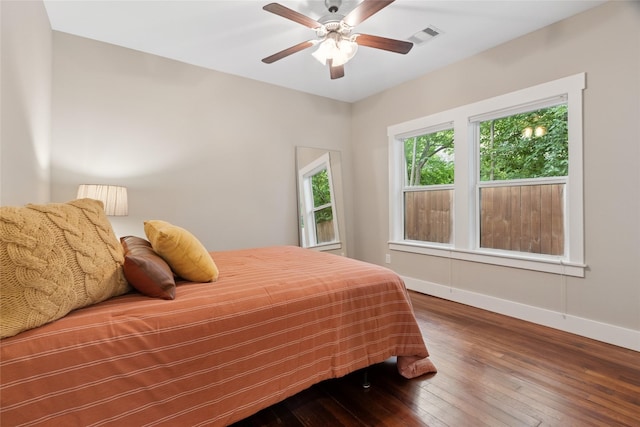 2714 Gano St, Houston, TX 77009 - bedroom featuring baseboards, hardwood / wood-style floors, and a ceiling fan