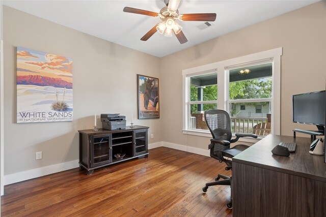 2714 Gano St, Houston, TX 77009 - office area featuring ceiling fan, wood finished floors, and baseboards