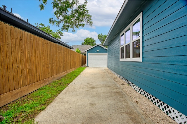 2714 Gano St, Houston, TX 77009 - view of home's exterior with driveway, an outbuilding, fence, and a garage