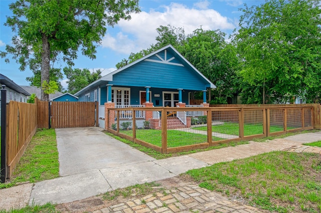 2714 Gano St, Houston, TX 77009 - view of front of house featuring a porch, a gate, and concrete driveway