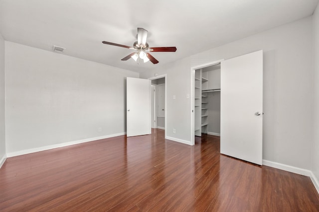 4166 Belle Park Dr Unit 4166, Houston, TX 77072 - unfurnished bedroom with a walk in closet, wood finished floors, baseboards, and a closet