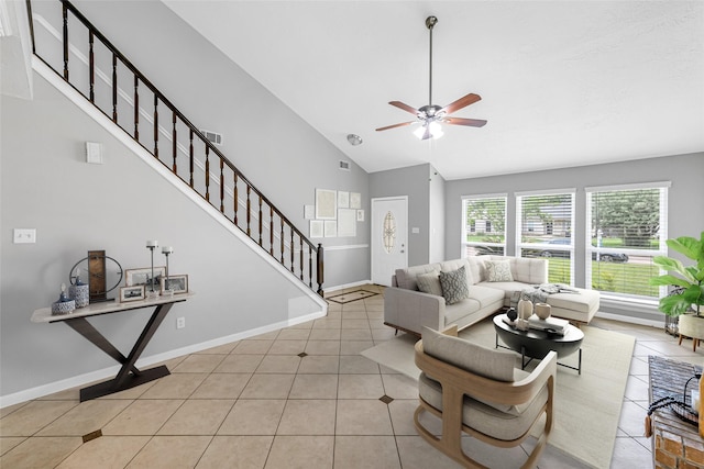 2526 Windswept Dr, Richmond, TX 77406 - living room featuring a ceiling fan, tile patterned flooring, stairway, baseboards, and high vaulted ceiling