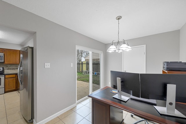 2526 Windswept Dr, Richmond, TX 77406 - home office with light tile patterned floors, a chandelier, and baseboards