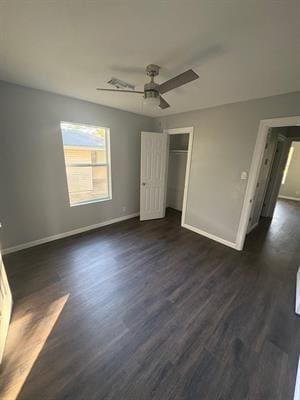 6240 25th St, Groves, TX 77619 - unfurnished bedroom with baseboards and dark wood finished floors