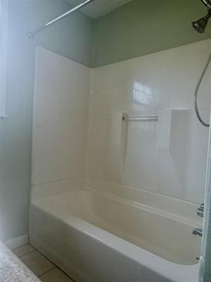 612 S 15th St, Nederland, TX 77627 - full bathroom with shower / bath combination, tile patterned floors, and baseboards