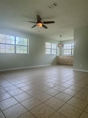 612 S 15th St, Nederland, TX 77627 - empty room featuring baseboards, a ceiling fan, and tile patterned floors