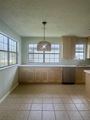 612 S 15th St, Nederland, TX 77627 - unfurnished dining area featuring a sink, a textured ceiling, and baseboards