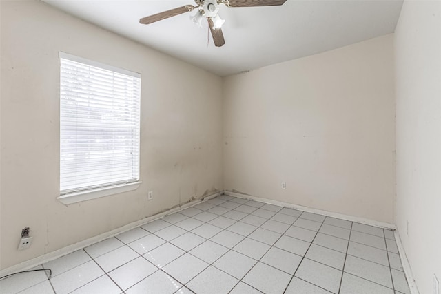 1911 Thonig Rd, Houston, TX 77055 - empty room with a ceiling fan, light tile patterned floors, and baseboards