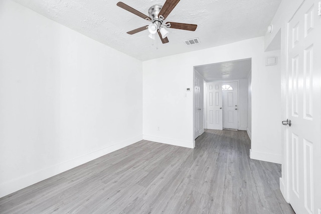 7109 Chasewood Dr, Houston, TX 77489 - spare room featuring ceiling fan, a textured ceiling, wood finished floors, and baseboards