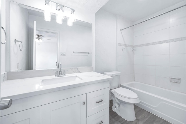 7109 Chasewood Dr, Houston, TX 77489 - bathroom with wood finished floors, toilet, vanity,  shower combination, and a ceiling fan
