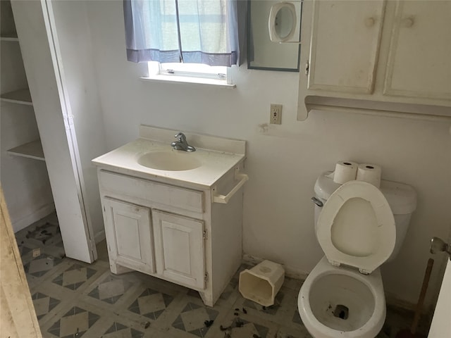 1401 8th St, Bay City, TX 77414 - bathroom with toilet, vanity, and tile patterned floors