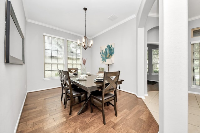 419 Sunny River Ln, Richmond, TX 77406 - dining space featuring wood finished floors, baseboards, ornamental molding, and plenty of natural light