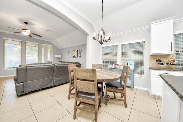 419 Sunny River Ln, Richmond, TX 77406 - dining room with lofted ceiling, ornamental molding, a chandelier, a ceiling fan, and light tile patterned floors