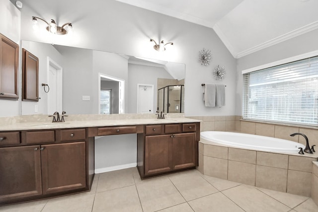 419 Sunny River Ln, Richmond, TX 77406 - bathroom featuring lofted ceiling, a bath, a shower stall, tile patterned flooring, and double vanity