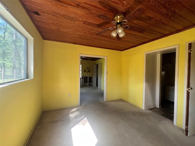101 Hidden Cove Dr, Point Blank, TX 77364 - spare room with wooden ceiling, ceiling fan, baseboards, and concrete flooring