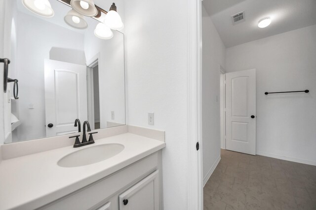 bathroom featuring vanity and baseboards