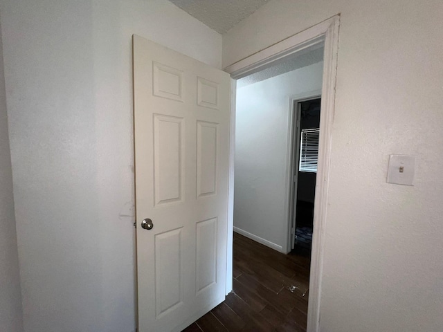 6343 Glenhagen Dr, Houston, TX 77084 - hallway with dark wood-style flooring and baseboards
