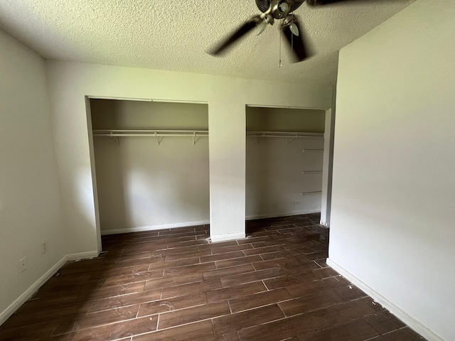 6343 Glenhagen Dr, Houston, TX 77084 - unfurnished bedroom featuring wood finished floors, multiple closets, a textured ceiling, a ceiling fan, and baseboards