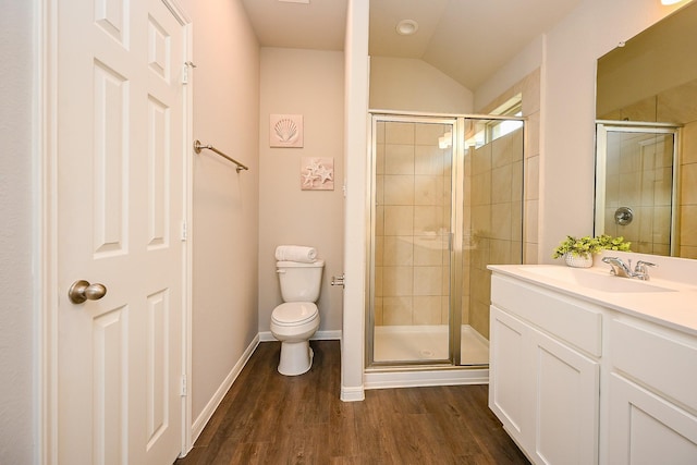 10130 Barn Owl Trl, Magnolia, TX 77354 - full bath featuring toilet, a shower stall, wood finished floors, vanity, and lofted ceiling