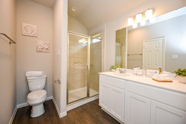 10130 Barn Owl Trl, Magnolia, TX 77354 - bathroom with a stall shower, wood finished floors, toilet, vanity, and vaulted ceiling