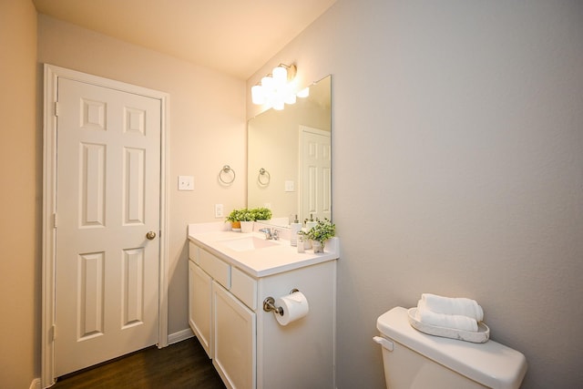 10130 Barn Owl Trl, Magnolia, TX 77354 - half bathroom featuring wood finished floors, toilet, and vanity