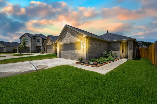 10130 Barn Owl Trl, Magnolia, TX 77354 - view of front facade featuring driveway, an attached garage, brick siding, and a shingled roof