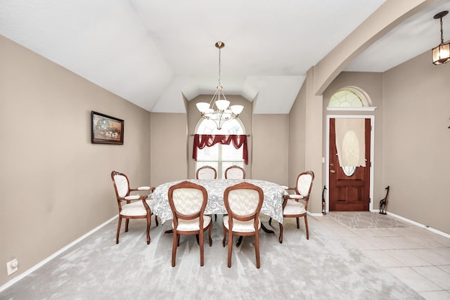 11843 Leaf Oak Dr, Houston, TX 77065 - dining area featuring a chandelier, baseboards, arched walkways, vaulted ceiling, and carpet